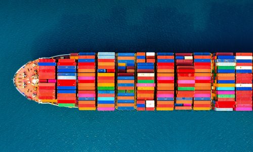 Aerial view of container cargo ship in sea.